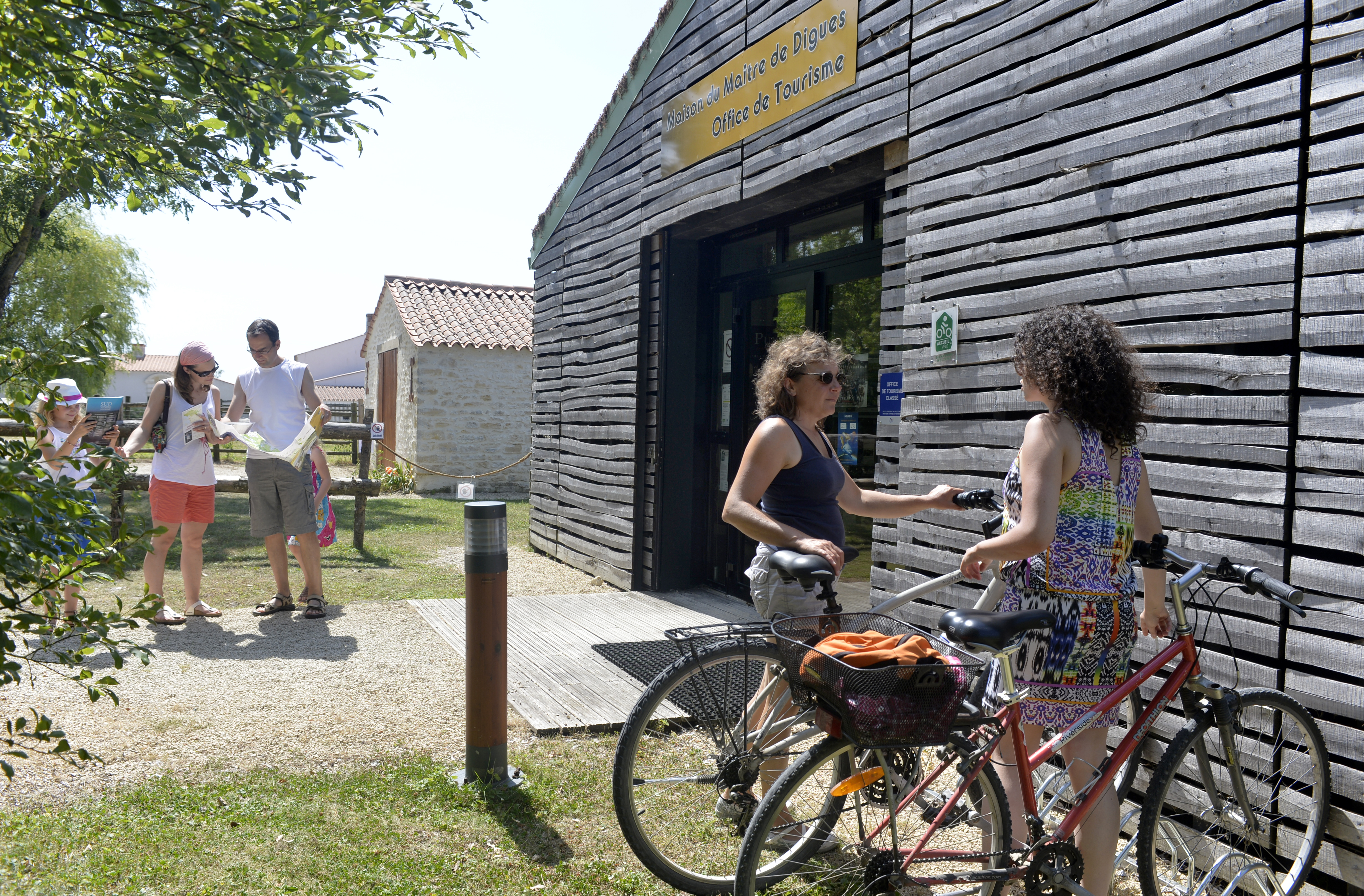 The house of the dike master labeled  Accueil Vélo